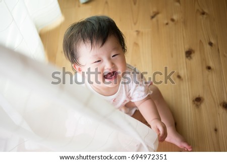 Baby playing with curtain / Japanese baby 8 months after birth