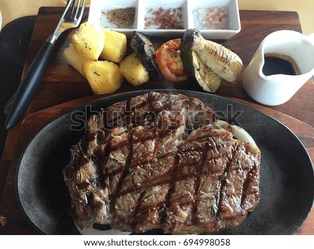amazing delicious homemade grilled Australian rib eye beef served with roasted vegetables and wine sauce background picture