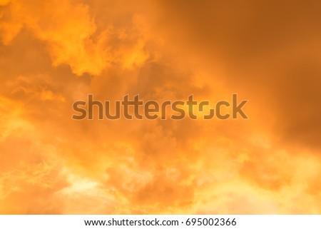 Oragne Clouds reflect sunlight In evening before a Thunderstorm, Dramatic look