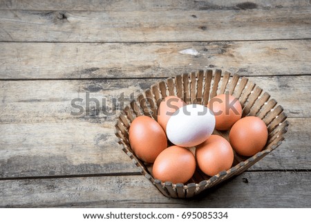 Close-Up Of Fresh Chicken Egg On Wooden Background, Eggs On Wood Texture