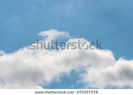 curve white clouds on color light blue sky