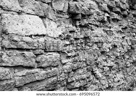 Background ancient medieval limestone wall, black and white