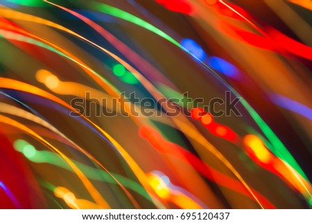 Abstract picture of bright colored dynamic lights on a dark background