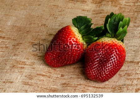 Strawberry on old wood background.