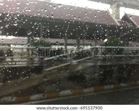 Rain drop with background of blurred train station
