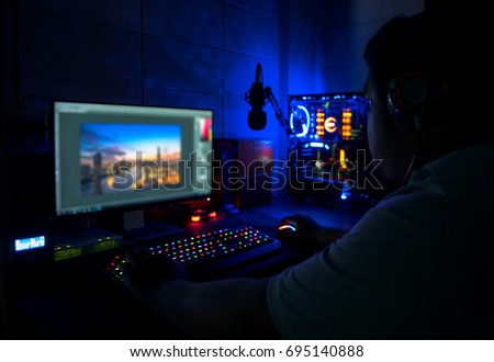 Photographers are editing computer images.