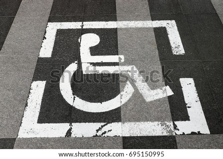 Disabled sign on the floor.