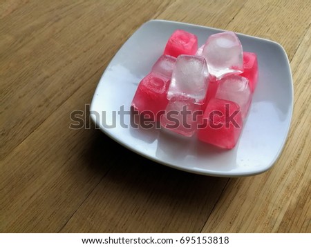 Pink Popsicles on a foil at home