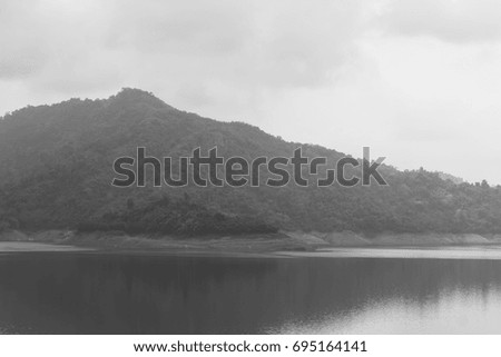 Khun Dan Prakarn Chon Dam, Beautiful dam covered with mist, Beautiful Landscape, black and White.

