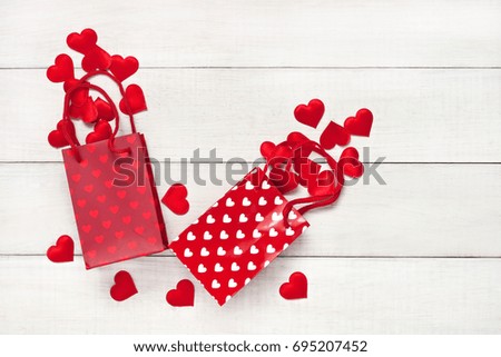 Happy Valentine's Day greeting card. Top view on romantic composition  with gift bags