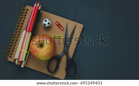 Top view of stationery education or business office desk concept.essential object on dark wood background.Copy space for free text design.