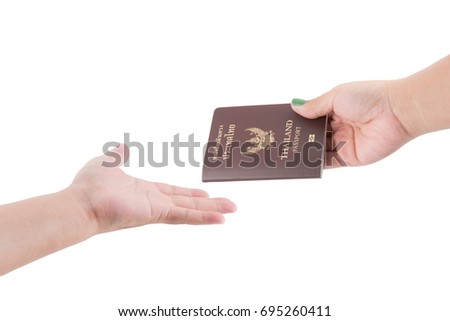 Woman hand holding passport isolated on white background.