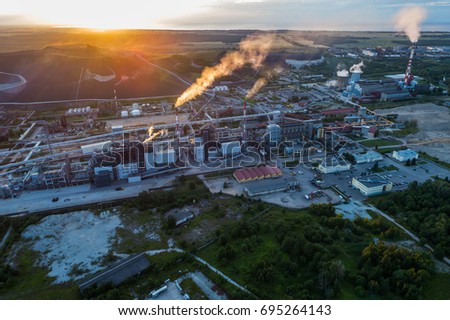 Aerial view Oil refinery with a background of mountains and sky at sunset. Aerial photography.
