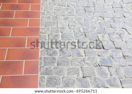 City pavement floor pattern. Red ceramic tile and gray  cobble. Top view
