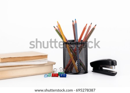 Colored pencils in a case on white background
