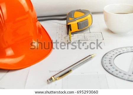 Blue print and measurement tool on architect's desk, architectural concept