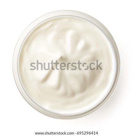 Bowl of cream isolated on white background, top view