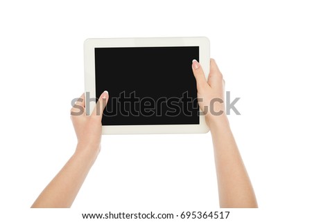 Woman's hands holding digital tablet and pointing on blank screen isolated on white background, close-up, cutout, copy space on the screen
