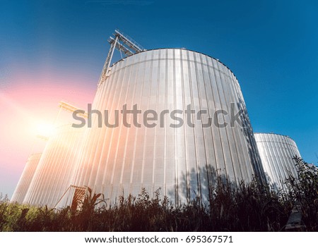Modern silos for storing grain harvest. Agriculture. Background