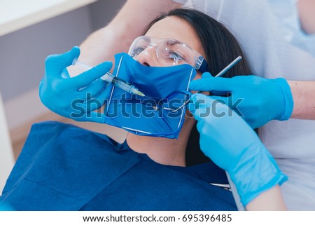 Medicamentous treatment of root canals during endodontic treatment. Modern technology Royalty-Free Stock Photo #695396485