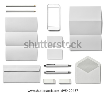 collection of  various white business print, pen, pencil  and phone and tablet templates on white background. each one is shot separately