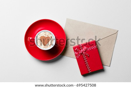cup of coffee, gift and envelope 