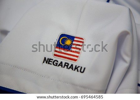 Close-up Of embroidery Malaysia Logo with Wording NEGARAKU My Country on white uniform