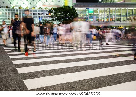 Crosswalk and pedestrian at modern city zebra crossing street in the Shibuya Crossing, TOKYO