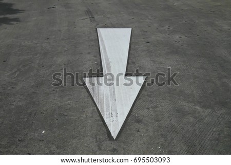 White arrow pointing down Royalty-Free Stock Photo #695503093