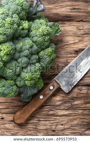 Fresh green cabbage on rustic wooden background