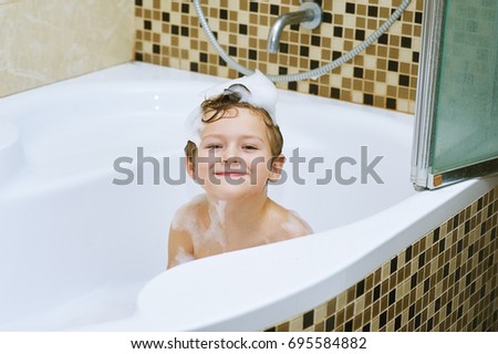 Children taking a bath .