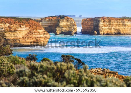 Wave of Very Big rock in the sea, Aerial view of High orange cliff with observation deck on the Great Ocean Road in the Port Campbell National Park Victoria, Australia.