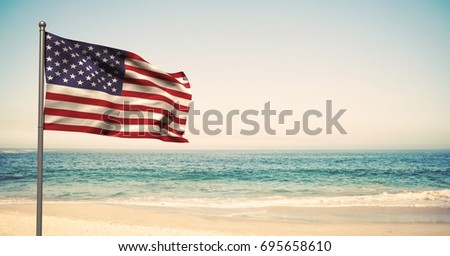Digital composite of USA flag in the beach