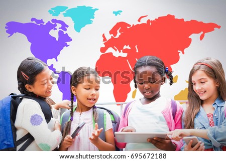 Girl with friends using digital tablet against grey background