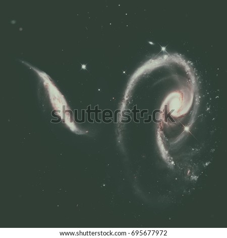 A Rose Made of Galaxies UGC 1810 and UGC 1813. Group of spiral galaxies in the constellation Andromeda. Elements of this image furnished by NASA.