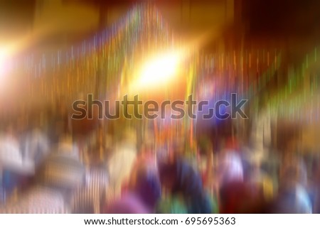 Crowd of people shot with motion blur effect.