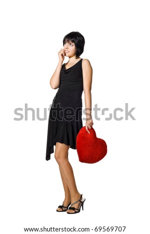 Beautiful young woman holding a red heart, Valentine concept