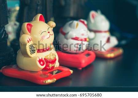 Maneki Neko Japanese lucky cat figures
 Royalty-Free Stock Photo #695705680