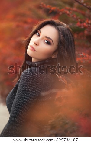 Autumn Woman Portrait. Beauty Fashion Model Girl with Autumnal Make up. Fall.