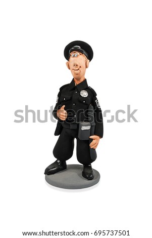Clay statuette of smiling policeman in black uniform isolated on white background