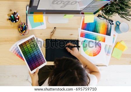 girl designing a logo at design studio
