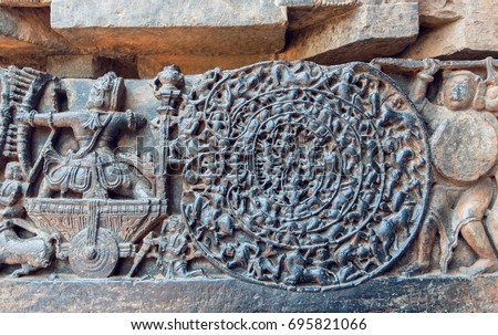 Hindu epic Mahabharata scene in carvings. Story of warrior Abhimanyu entering the Chakravyuha on stone artworks of the 12th century Hoysaleshwara temple in Halebidu, India.