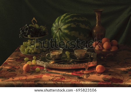 Still life with watermelon, grapes and other fruits