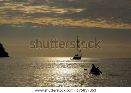 Family Sea Kayaking at Sunset