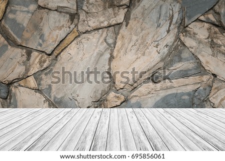Stone wall texture background surface natural color with wood terrace