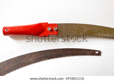 Hand saw on white table