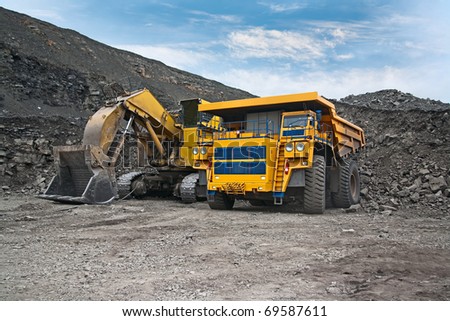 picture of a large mining trucks and excavators