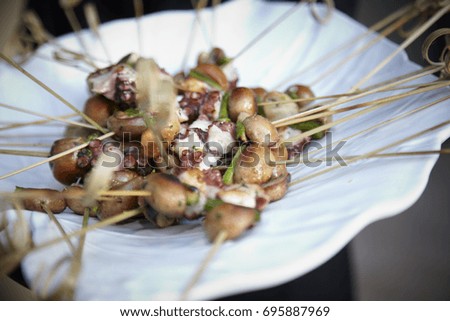 Octopus food. Spanish Tapas. Party appetizers. Horizontal format. Close up picture. 