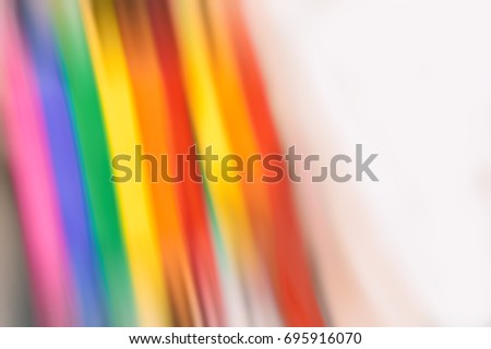 Motion blurred picture of a gay rainbow flag during pride parade. Concept of LGBT rights.
