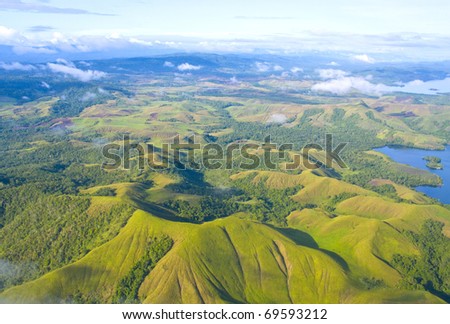 Aerial photo of the  coast of New Guinea with jungles and deforestation Royalty-Free Stock Photo #69593212